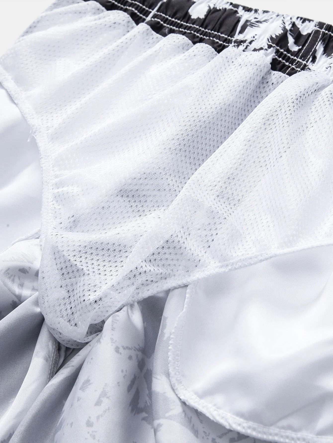 Pantalones cortos de natación con estampado de palmera